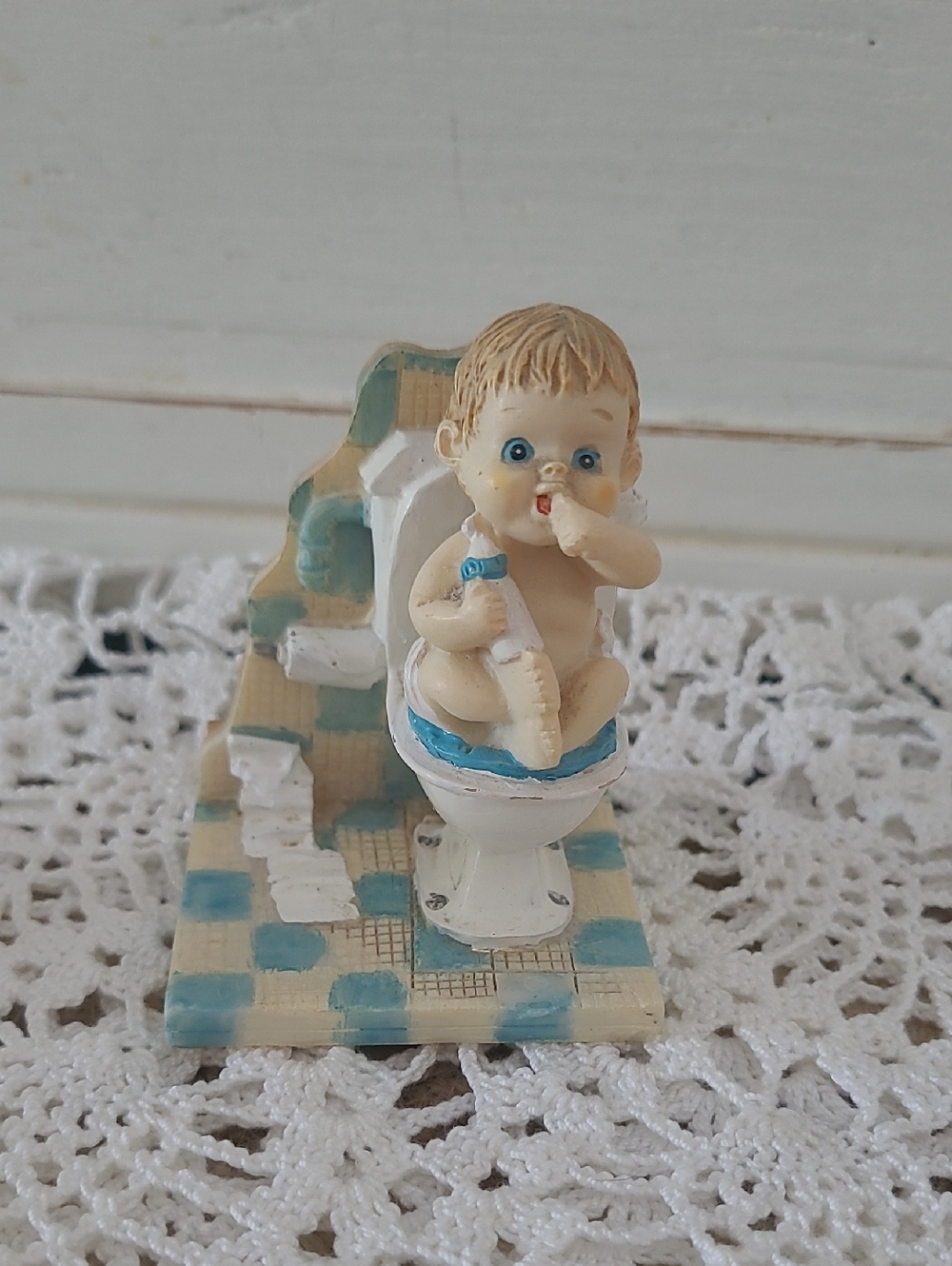 Baby On A Toilet Holding A Bottle, 3x2 Inches, Blue Eyes, Sucking Thumb